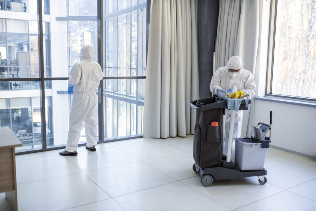full-shot-people-hazmat-suit-cleaning
